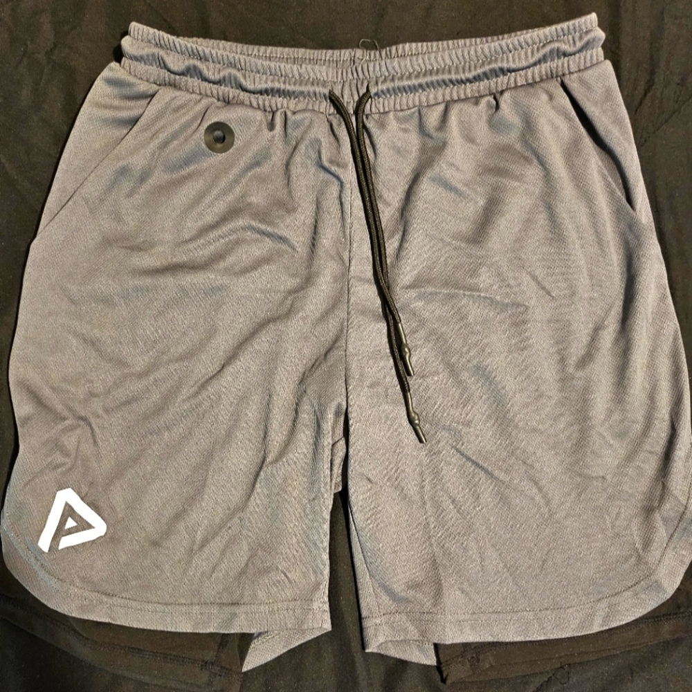 Gym shorts with compression short attached